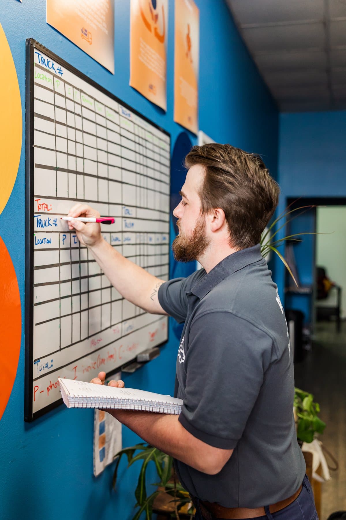 A Junk Trunk dispatcher updating the truck board for the day